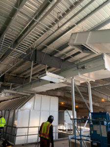 Industrial electrical installation with overhead cable trays and conduits by Olson Electrical Services in Reno, NV