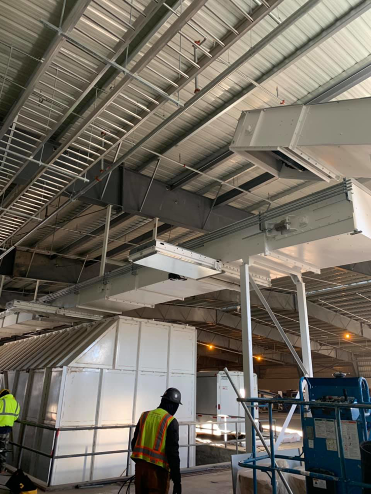 Industrial electrical installation with overhead cable trays and conduits by Olson Electrical Services in Reno, NV