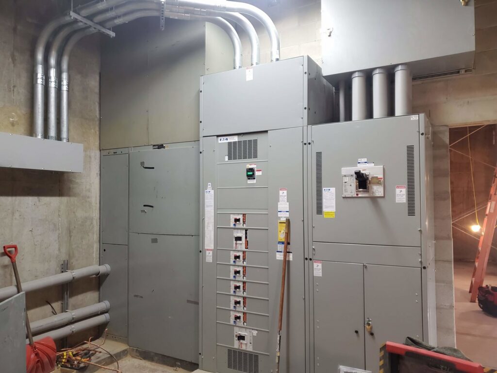 Large industrial electrical switchgear and panels installed by Icon West Corporation Electrical Contractors in Springfield, MA.