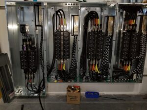 Large industrial electrical switchgear and panels with extensive wiring, installed by York Electrical Services in York, PA.