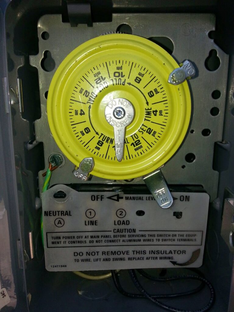 A close-up of an industrial electrical timer, indicating installation or maintenance by Sterling Wiring Solutions in Pearland, TX.