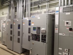 A row of industrial electrical transfer switches and panels installed by BESCO in Knoxville, TN.