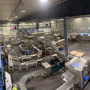 An overhead view of an industrial facility with numerous conveyor belts and machinery, typical for projects by 509 Electric in Yakima, WA.