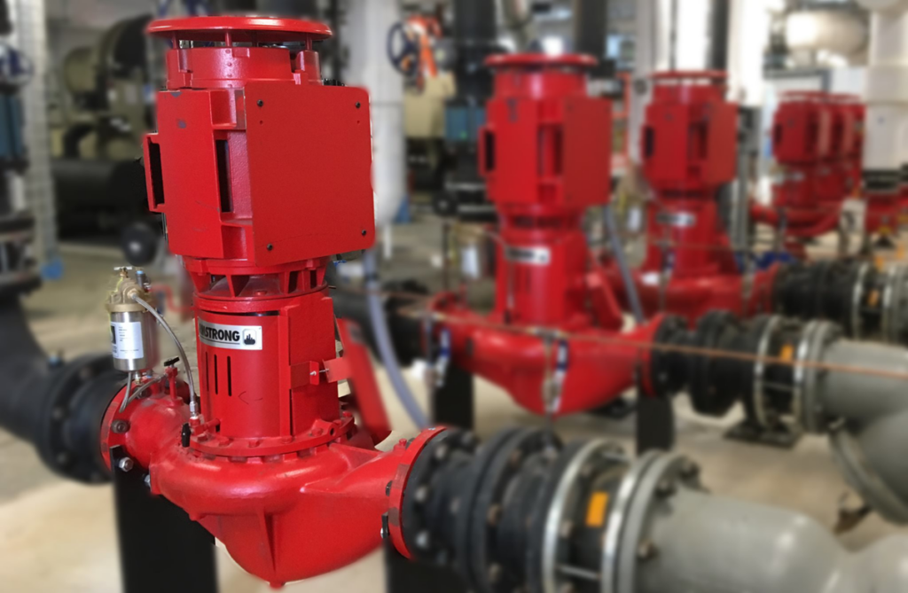 Red industrial HVAC pumps and piping installed by Jaco Sales, Inc. in Little Rock, AR.
