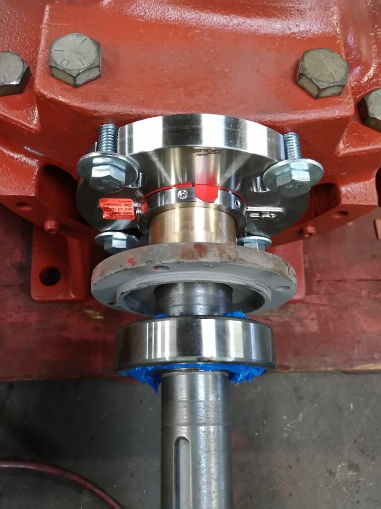 Close-up of an industrial motor shaft coupling, indicating precision repair services by Caddell Electric Co Inc in Dallas, TX.