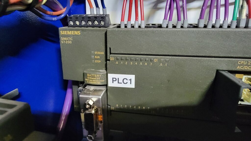 A Siemens PLC (Programmable Logic Controller) with industrial wiring, serviced by MCM Electrical Services LLC in Phoenix, AZ
