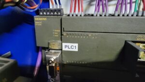 A Siemens PLC (Programmable Logic Controller) with industrial wiring, serviced by MCM Electrical Services LLC in Phoenix, AZ