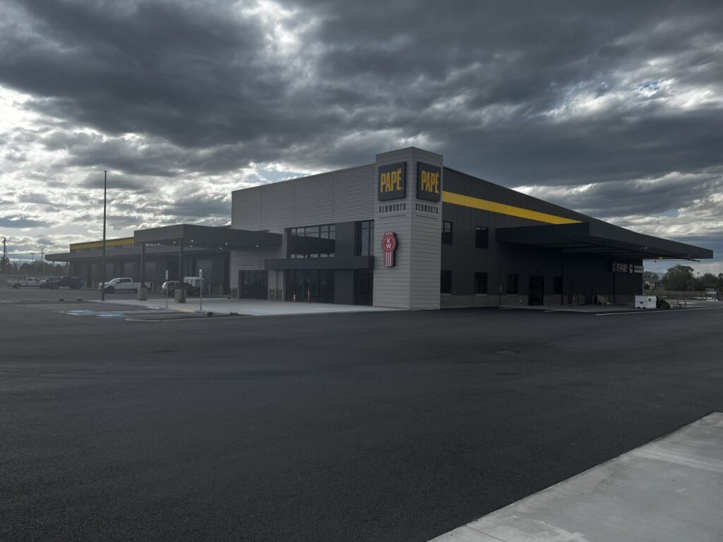 A large industrial processing machine with a digital control screen, indicating complex electrical installation by 509 Electric in Yakima, WA.