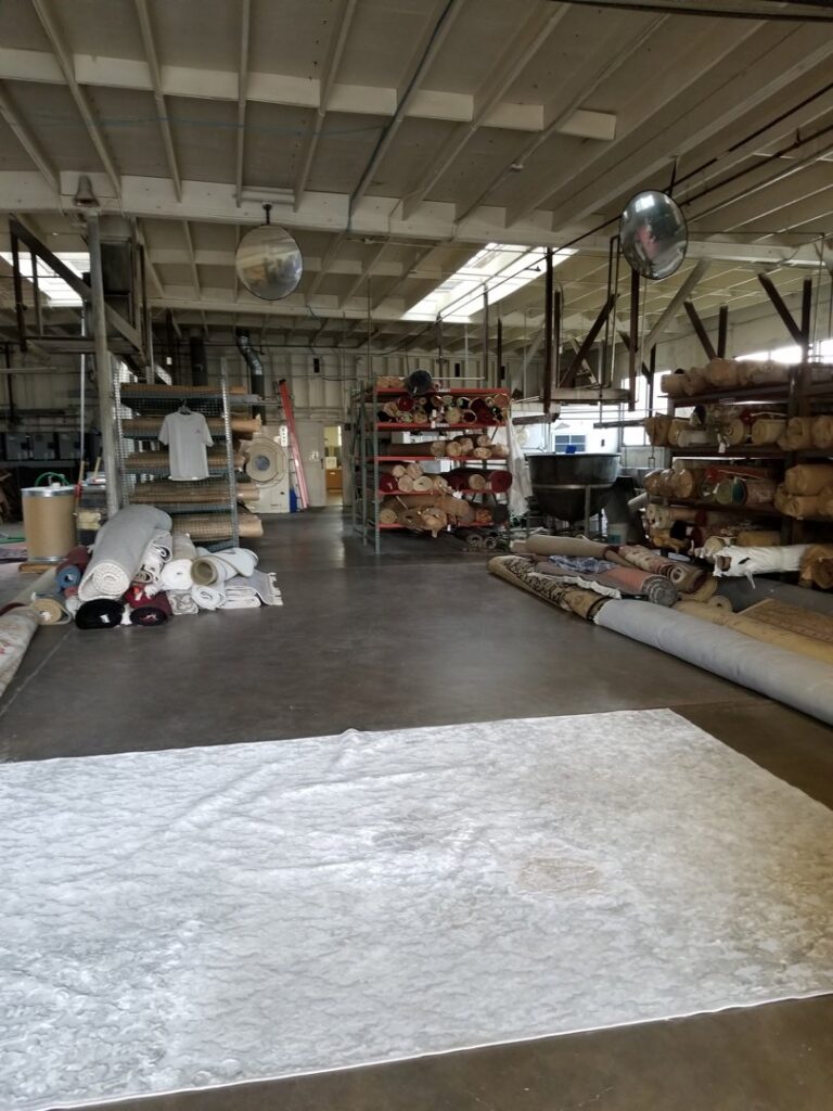 An industrial machine used for professional rug cleaning and processing at Deluxe Dye Works in San Jose, CA.