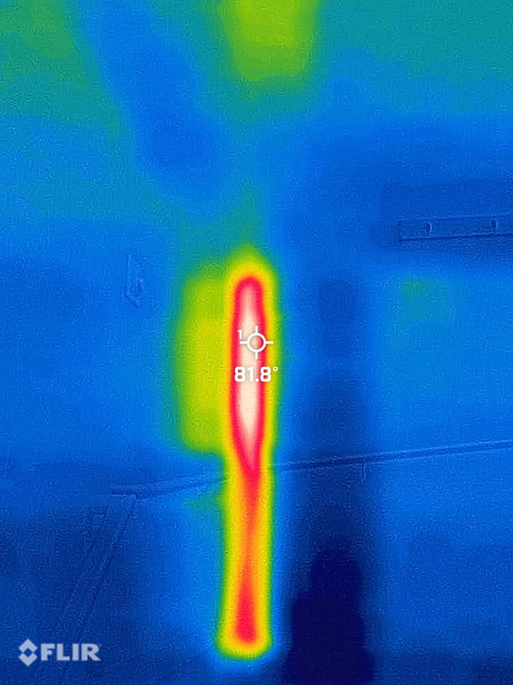 An infrared scan showing a vertical hot spot in a wall, indicating a hidden bee colony, by A&E Bee Extraction and Control in Mount Pleasant, SC.