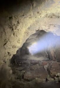 An interior view of a dirty chimney flue, likely during an inspection or cleaning by Maximum Energy Savers in Philadelphia, PA