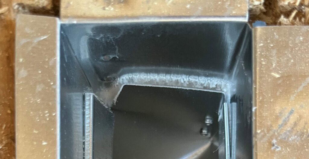 A close-up view inside a duct showing sealant application by Green Seal Energy in Overland Park, KS.