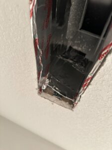A close-up view inside a duct showing tape and sealant applied by Green Seal Energy in Overland Park, KS.