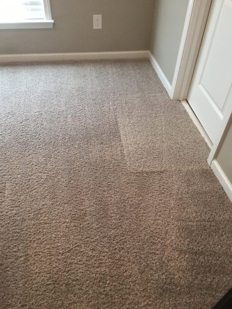 A view of a room with newly installed beige carpet by Multi-Family Flooring in North Charleston, SC.