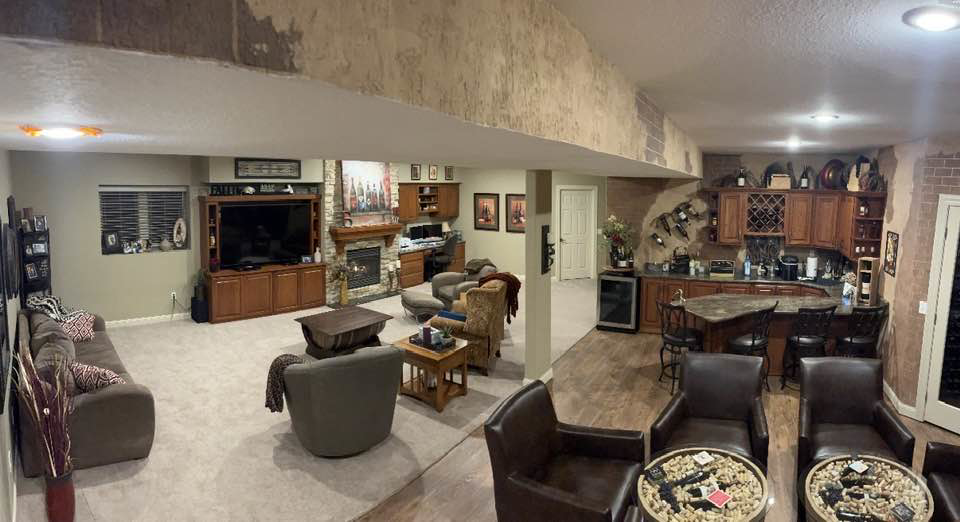 A spacious finished basement living area with newly installed light-colored carpet by Home Dynamics Flooring LLC in Harrisburg, SD.