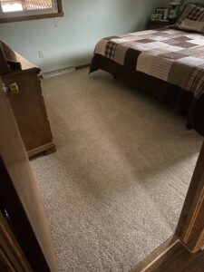 A newly installed carpet covering the floor of a bedroom by Lakefront Flooring in Erie, PA.