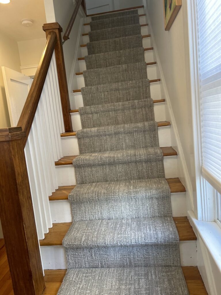 Close-up of a freshly installed carpet, showing quality craftsmanship by FCO Carpet Remnant STORE in Pawtucket, RI.
