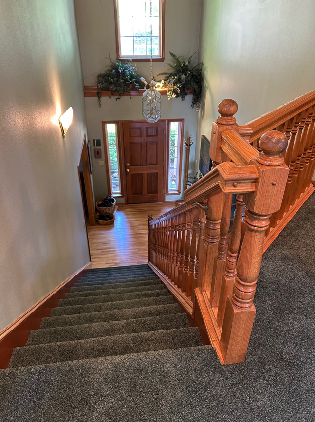 A beautifully installed dark grey carpet on a residential staircase by Johnson Flooring in Newberg, OR.