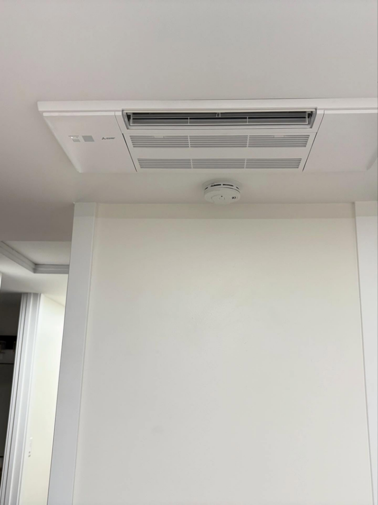 A newly installed ceiling-mounted HVAC cassette unit in a residential or commercial space by Royal Heating & Air LLC in Sparks, NV