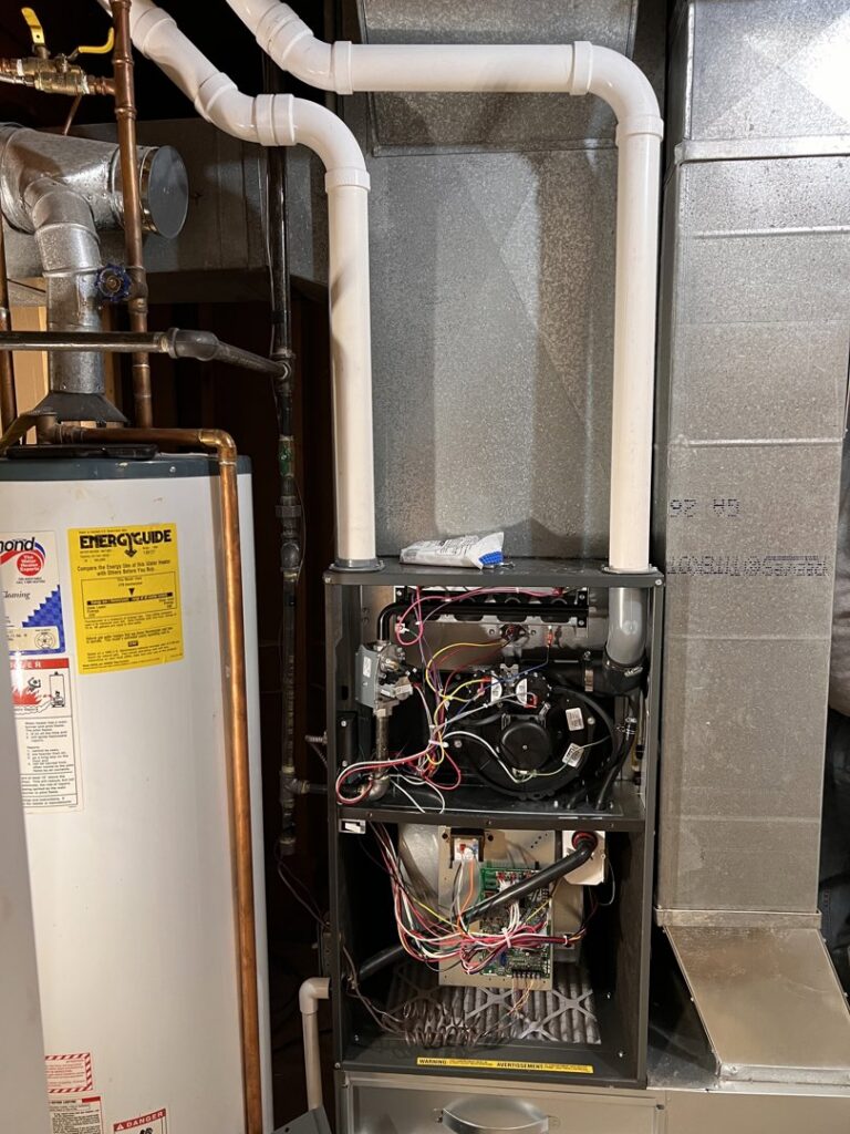 A newly installed garage heater mounted on the ceiling, providing warmth for the space by TruLine HVAC in Cedar Rapids, IA.