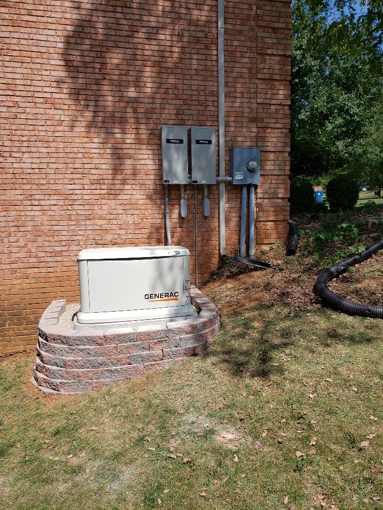 An installed Generac generator with visible electrical panels by Morris Electric Co. Inc. in Louisville, KY.