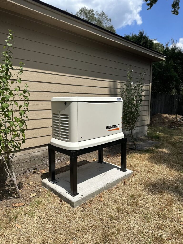 An installed Generac whole-home generator on an elevated stand next to a house by Never Without Power Generators LLC in Huffman, TX.