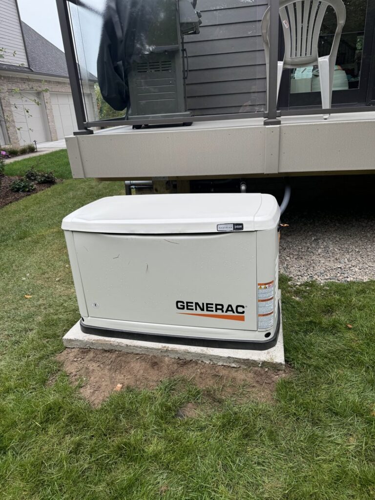 A newly installed Generac standby generator on a concrete pad next to a home by Electric R US LLC in Dearborn, MI.
