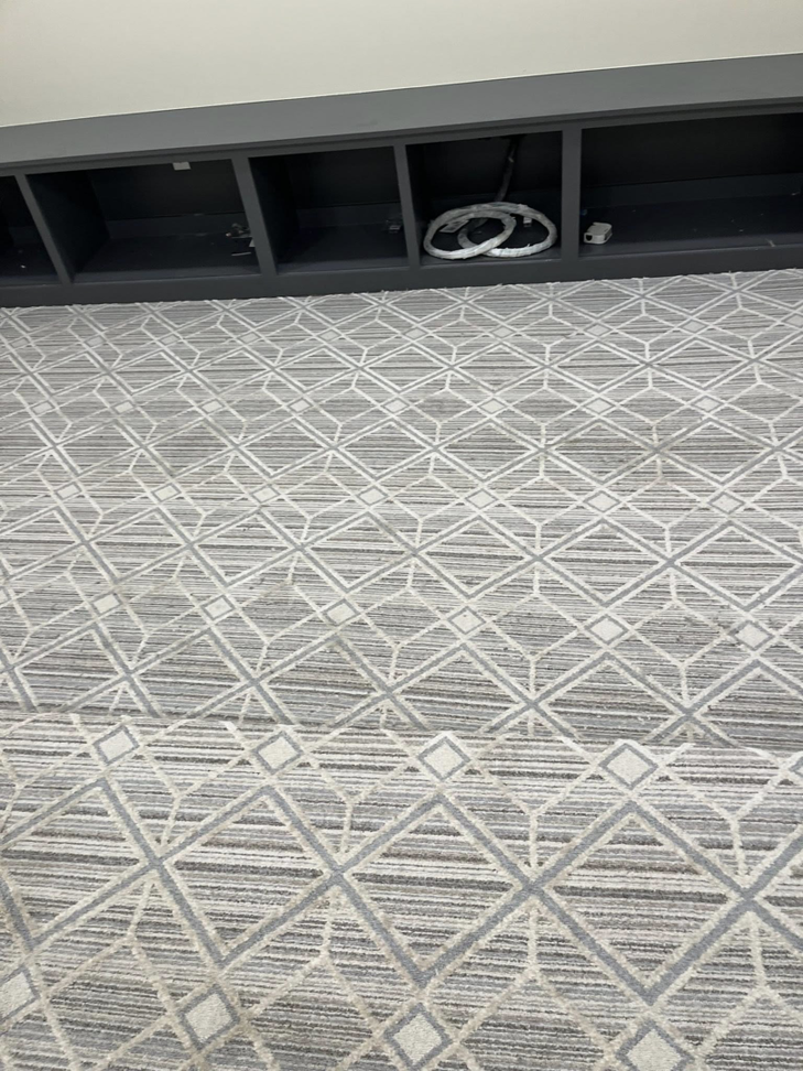Newly installed geometric pattern carpet in a room by Flooring Liquidator in Orem, UT.