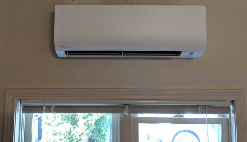 A newly installed wall-mounted mini-split indoor unit by Total Comfort Heat and Air Conditioning, Inc. in Rochester, NY.