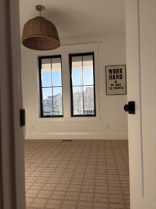 Newly installed patterned carpet in a residential room by Luke Brothers Flooring in Ankeny, IA.