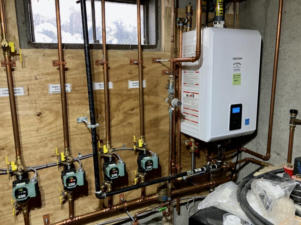 A newly installed tankless water heater and heating system by Blue Bear Plumbing, Heating, & Air in Norwell, MA.