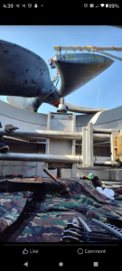 Technicians installing a large 132-inch HVAC fan blade for an industrial system, performed by CMC Mechanical in Goose Creek, SC.