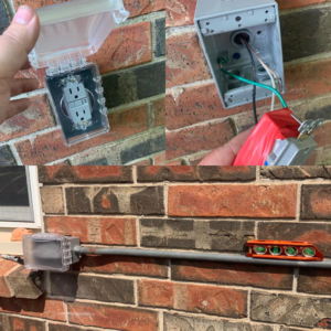 An electrician installing an outdoor electrical outlet and conduit on a brick wall for Lightningwerks Electrical in Springfield, MO.