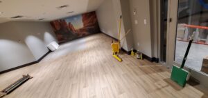 Installing new patterned carpet in a large commercial space by Az Budget Flooring LLC in Tucson, AZ