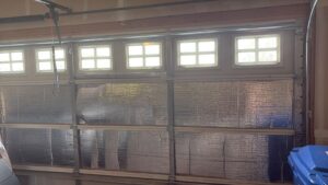 An interior view of a garage door with insulation panels installed by Greeley garage door repair in Greeley, CO.