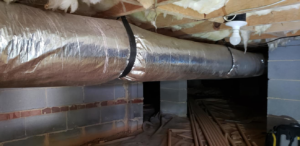 Insulated HVAC ducts running through a crawl space, installed by Henson's HVAC LLC in Rock Hill, SC.