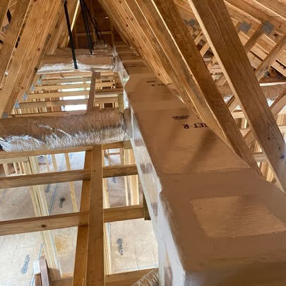 Insulated HVAC ductwork running through an attic space installed by Fields Cooling Heating & Refrigeration in Foley, AL.
