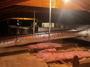 Insulated HVAC ductwork running through an attic space, installed by PureTemp Heating and Cooling in Salem, NH.