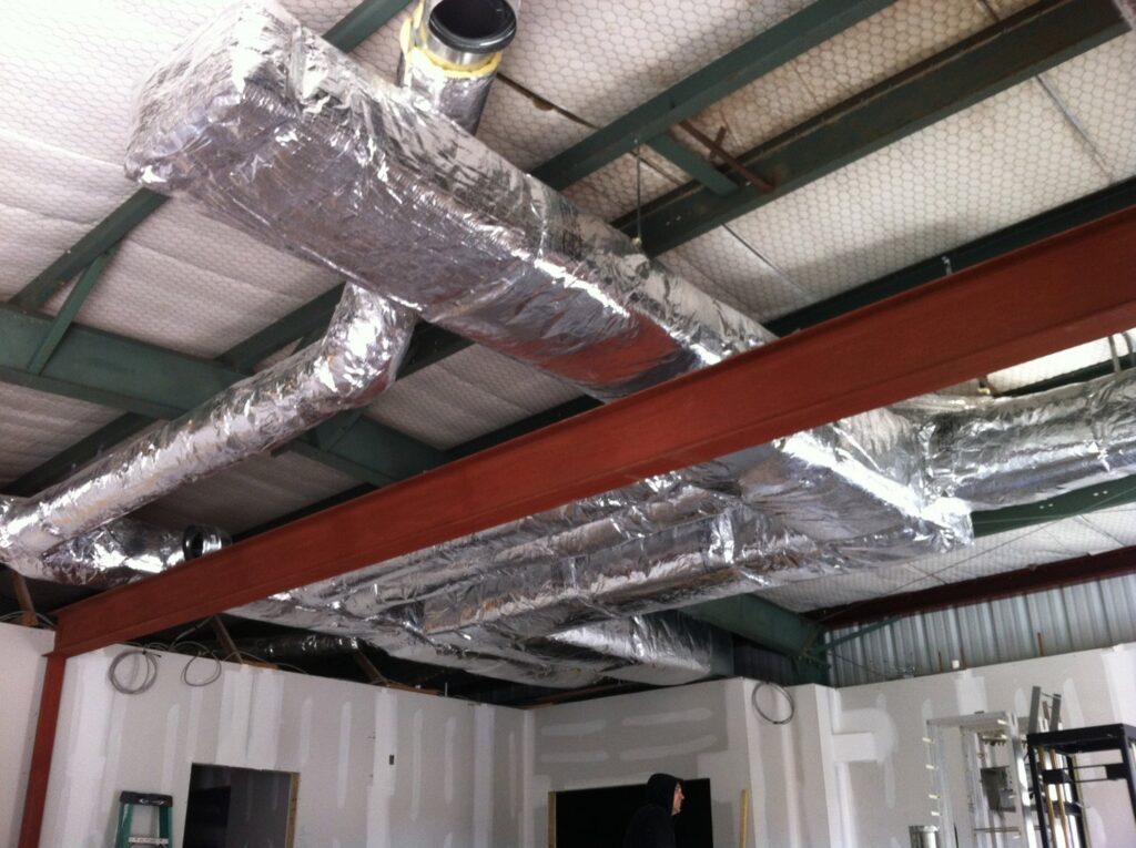 Insulated HVAC ductwork installed in a commercial building by R&B Cooling&Heating in Abbeville, LA.