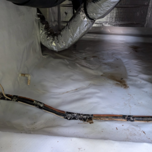 Insulated HVAC ductwork visible in a crawl space, installed by Speedy Nelson HVAC Repair in Durham, NC.