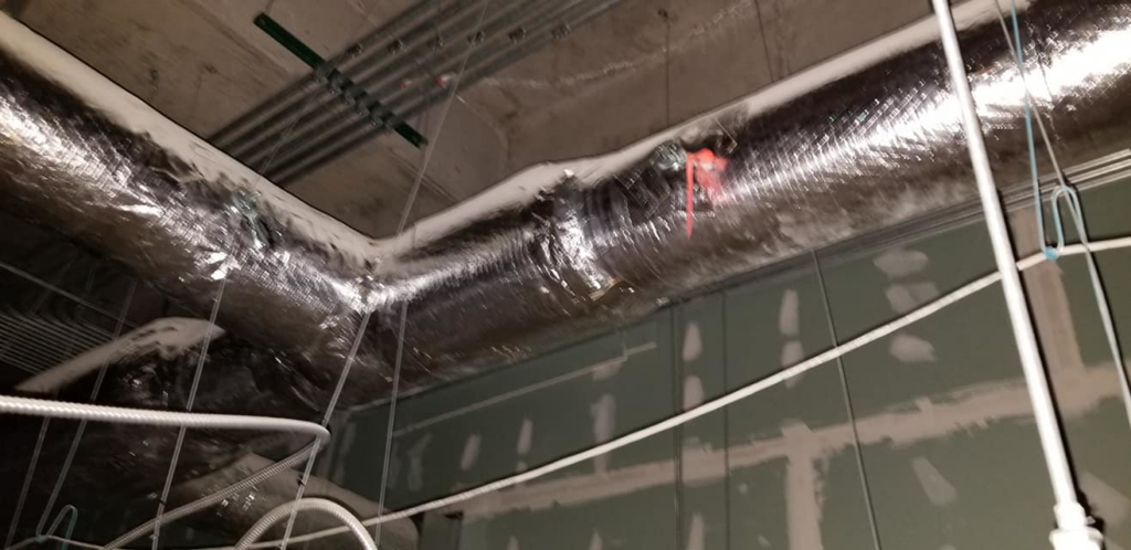 Insulated HVAC ductwork installed in a commercial building by Western Sheet Metal Works Inc. in Aurora, CO.