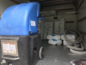 Insulation blowing machine and bags of Ecofill insulation inside a truck, used by The Squirrel Guys in Birmingham, AL.
