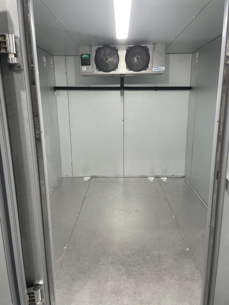 Interior view of a commercial walk-in freezer with two refrigeration units by CC Mechanical in Portland, ME.