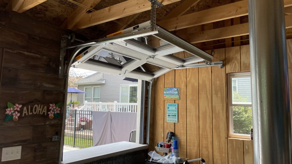 Interior view of a custom garage door mechanism for a bar area, installed by Superior Overhead Door, LLC in Granger, IN