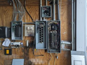 Interior wall showing electrical rough-in with blue boxes and wiring by Starnes Electric LLC in Rock Hill, SC.