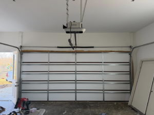Interior view of a white garage door with a LiftMaster opener installed by Guest Garage Door Company in Lexington, KY.