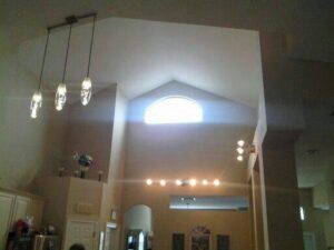 Interior high-ceiling room with various light fixtures installed by Acme Electrical & Ac Services Inc in Tampa, FL.