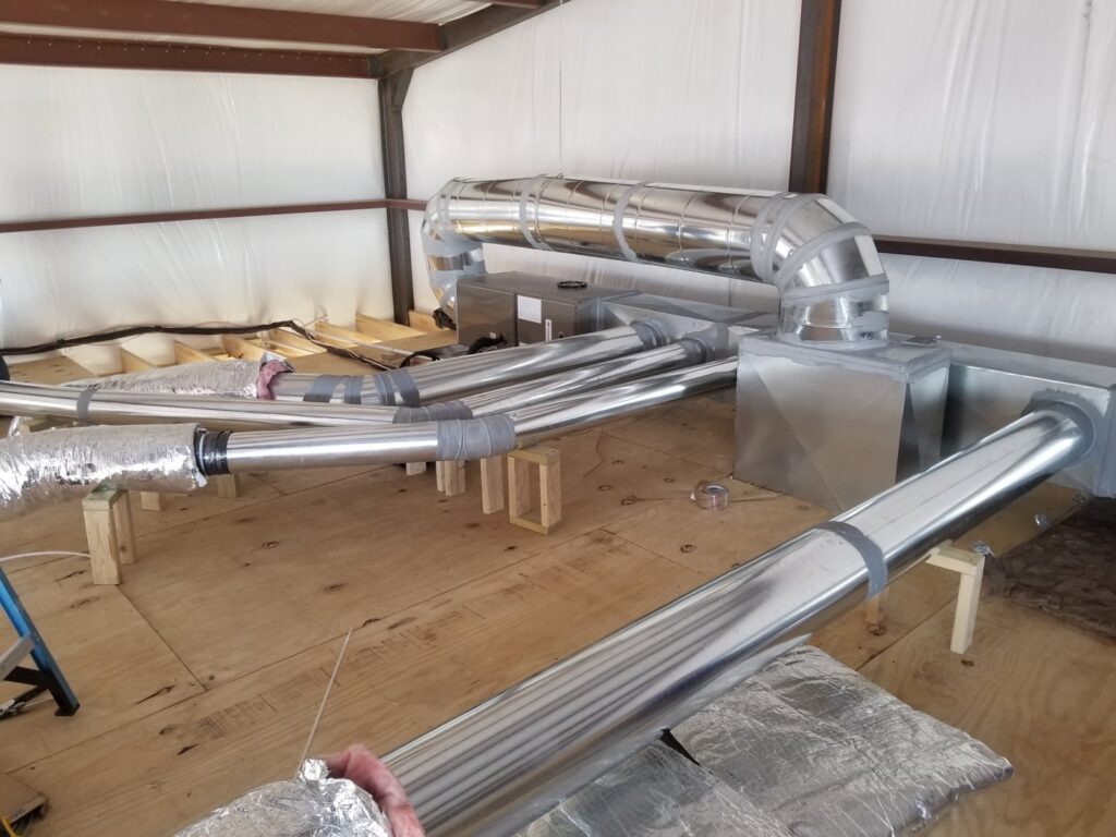Interior HVAC ductwork installation in a building under construction by After Hours Heating & Air Conditioning LLC in Chesapeake, VA.