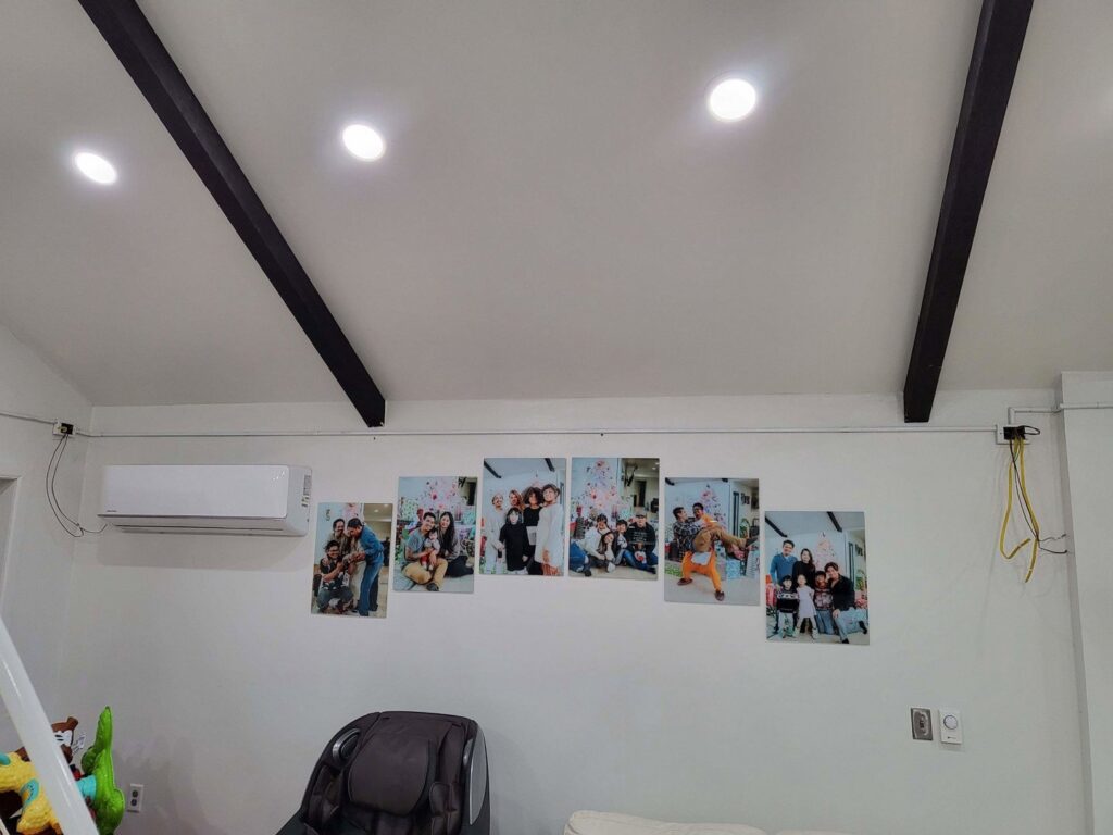 Interior view of a room with new recessed lighting and an AC unit installed by Minards Electric LLC in Dickinson, ND.