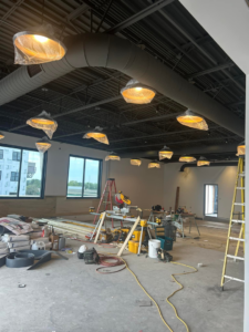 Interior lighting fixtures being installed at a commercial construction site by Streff Electric, Inc. in Cedar Rapids, IA